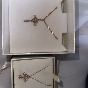 Left necklace (Gold Cross w/heart) Right necklace (Rosegold cross )